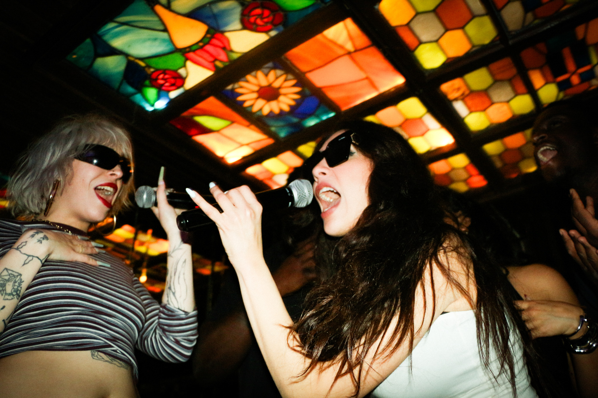 Soundproofed karaoke room with microphones and screen at The Blues Kitchen Brixton